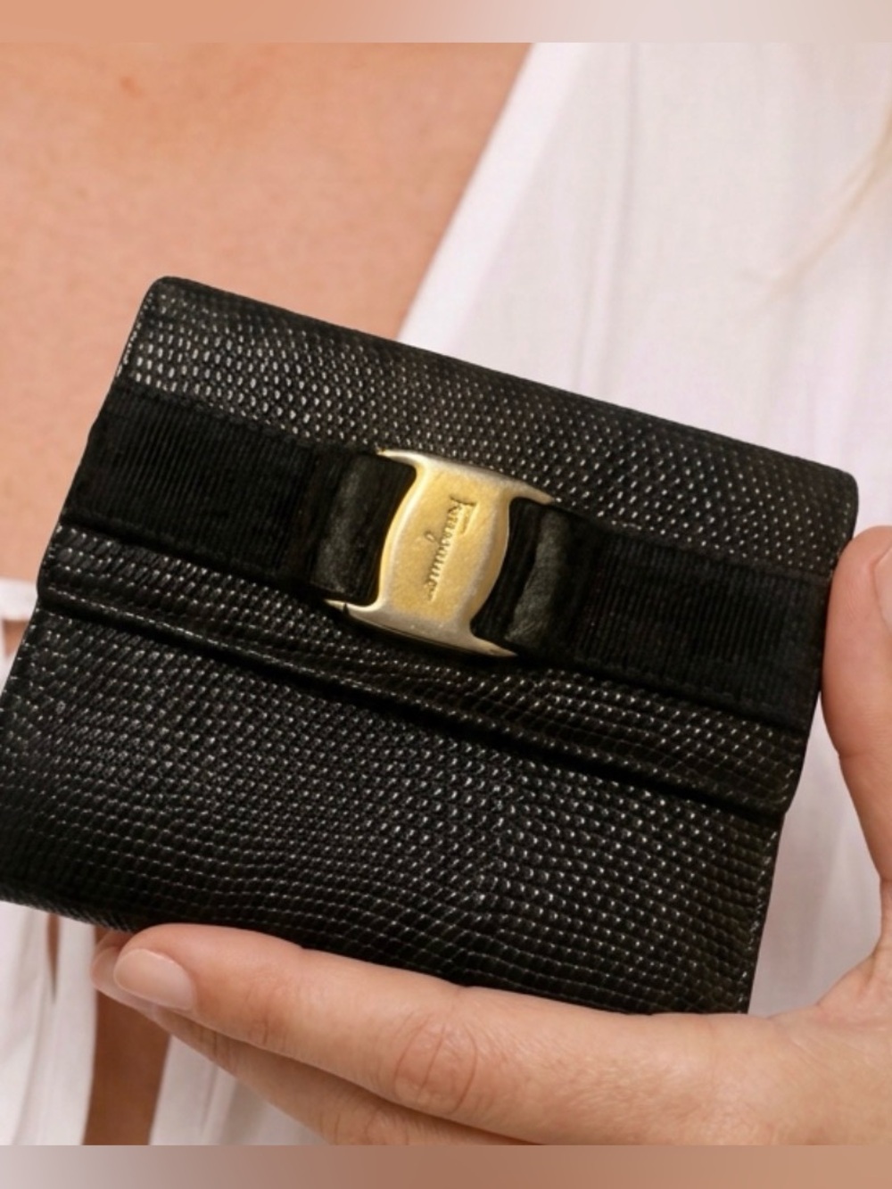 55D.  Leather wallet, Salvatore Ferragamo Vara Ribbon
Compact Bifold Gold Buckle